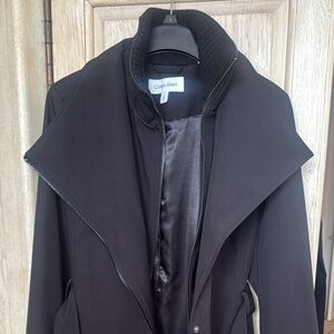 Brand new, lined Calvin Klein winter jacket .